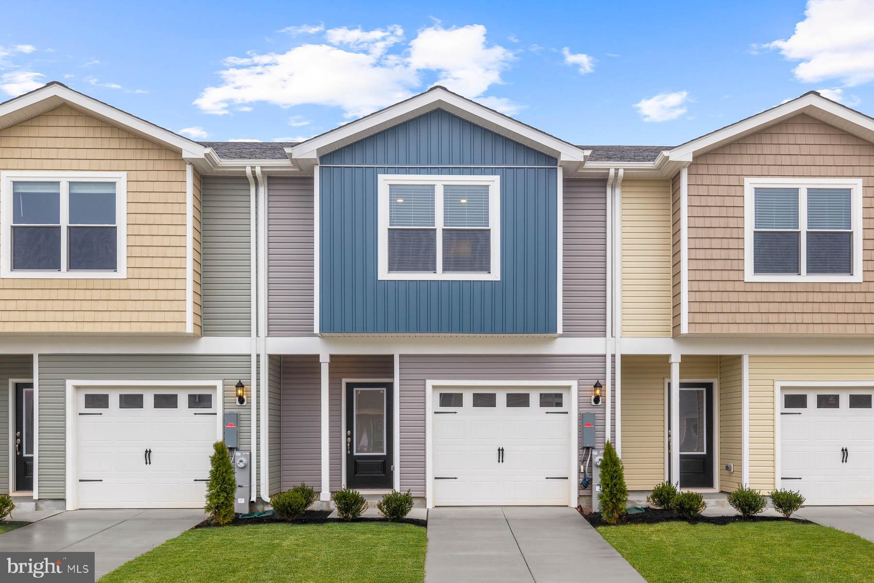 8155 Bartholomew Court Baltimore, MD 21206 - Photo 2 of 19 a front view of a house with a yard and garage