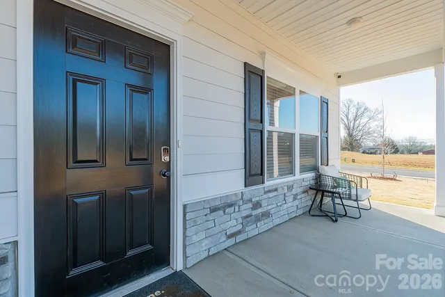 a view of two chairs in the room