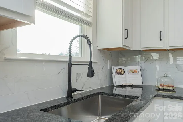 a kitchen with a sink and a window