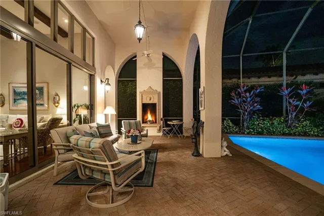 a view of a patio with table and chairs and potted plants