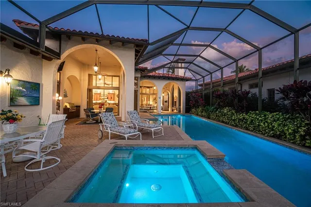 a view of a swimming pool with a patio