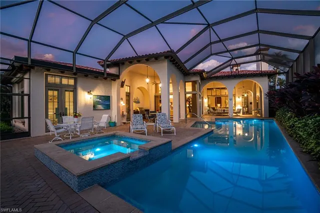 a living room with furniture and a pool table