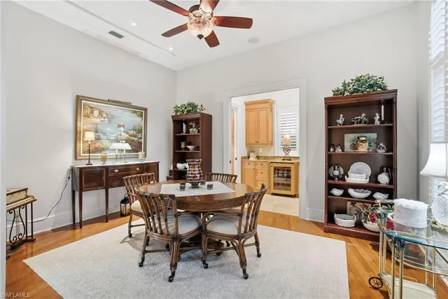 a dining room with furniture and window