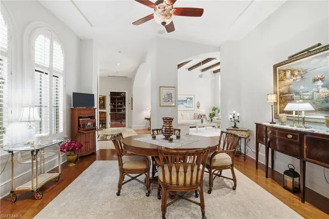 a view of a dining room with furniture and a livingroom