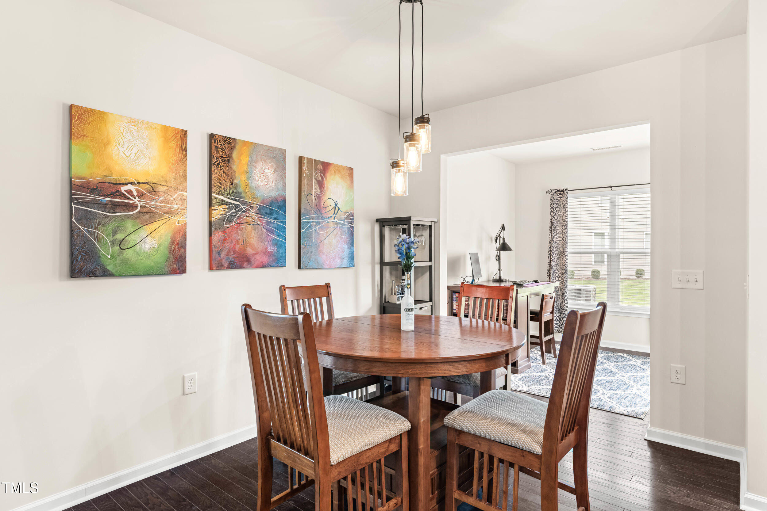 113 Lafferty Street Durham, NC 27703 - Photo 15 of 39 a view of a dining room with furniture window and wooden floor