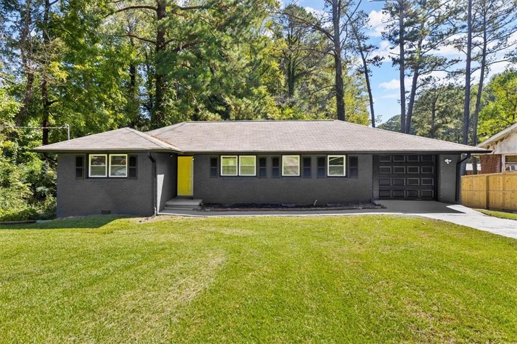 2238 Barge Road Southwest Atlanta, GA 30331 - Photo 1 of 1 a front view of a house with yard