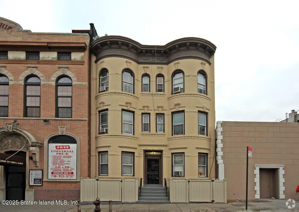 263 Bay Ridge Avenue Brooklyn, NY 11220 - Photo 1 of 3 a white building with glass windows