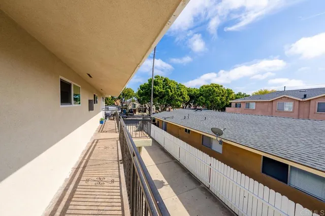 a view of balcony with furniture