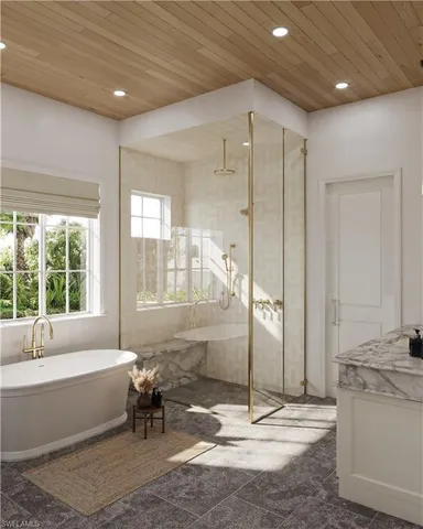 a spacious bathroom with a tub shower and sink