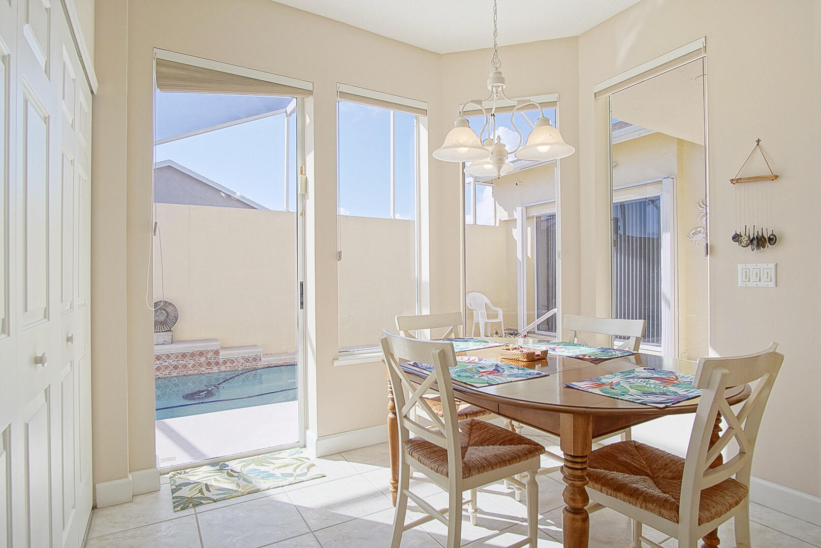 204 River Walk Fort Pierce, FL 34949 - Photo 14 of 30 a view of a dining room with furniture and chandelier