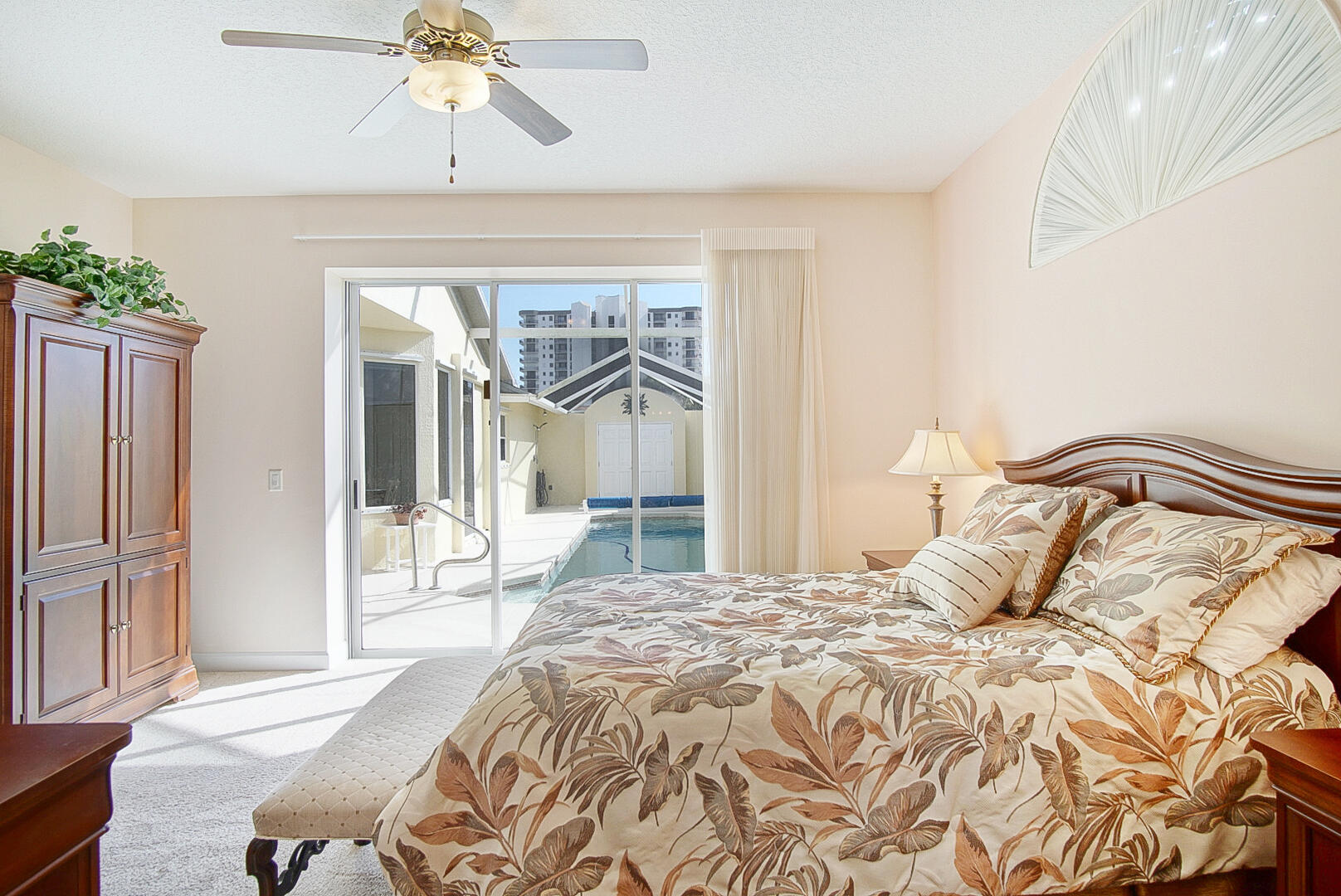 204 River Walk Fort Pierce, FL 34949 - Photo 19 of 30 a bedroom with a bed and glass walk in closet