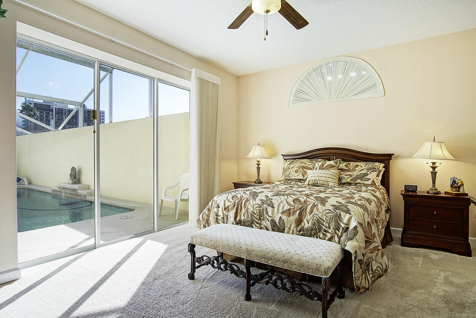 204 River Walk Fort Pierce, FL 34949 - Photo 20 of 30 a bedroom with a bed and a chandelier
