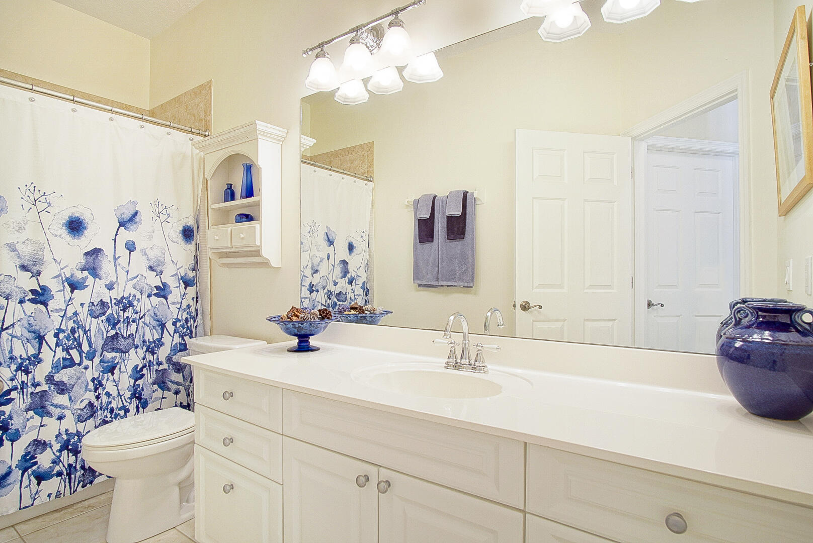 204 River Walk Fort Pierce, FL 34949 - Photo 25 of 30 a bathroom with a sink a toilet and a mirror