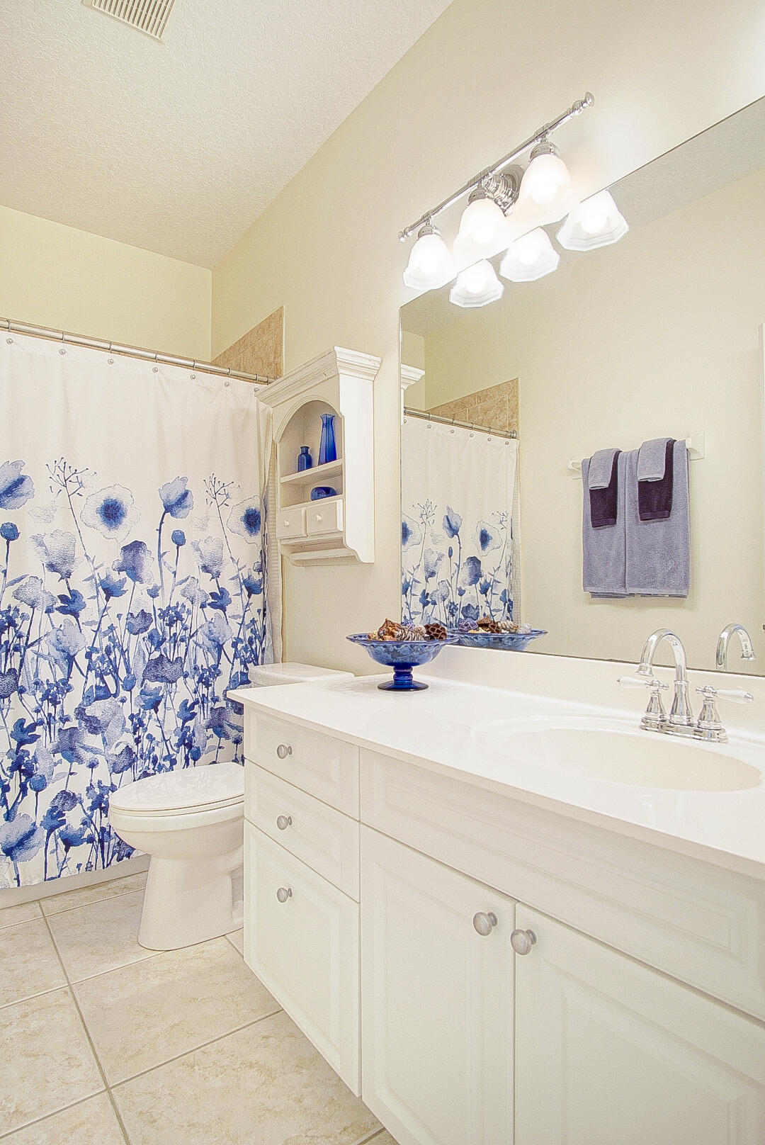 204 River Walk Fort Pierce, FL 34949 - Photo 26 of 30 a bathroom with a sink a vanity and a mirror