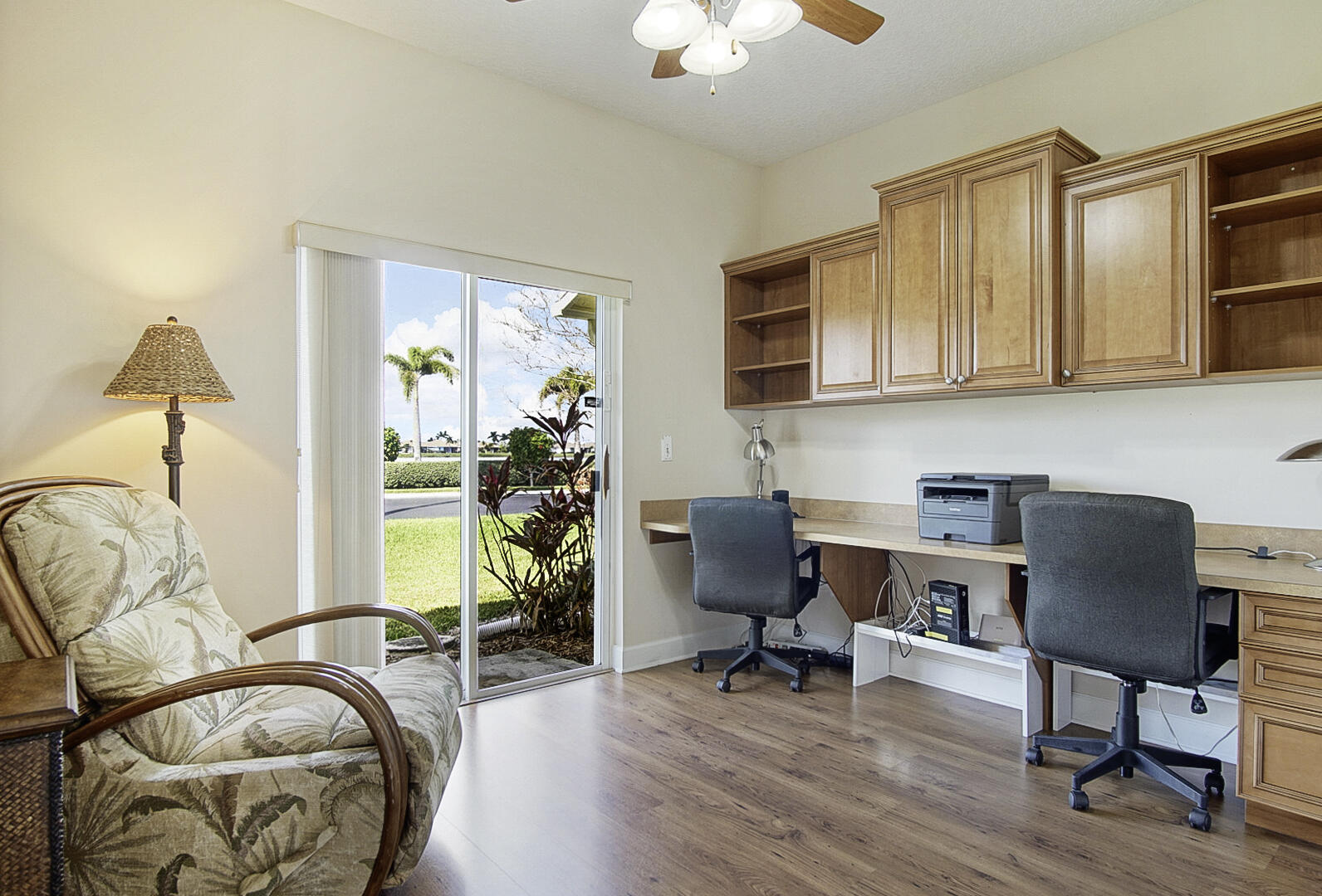 204 River Walk Fort Pierce, FL 34949 - Photo 27 of 30 a workspace with wooden floor and a chandelier