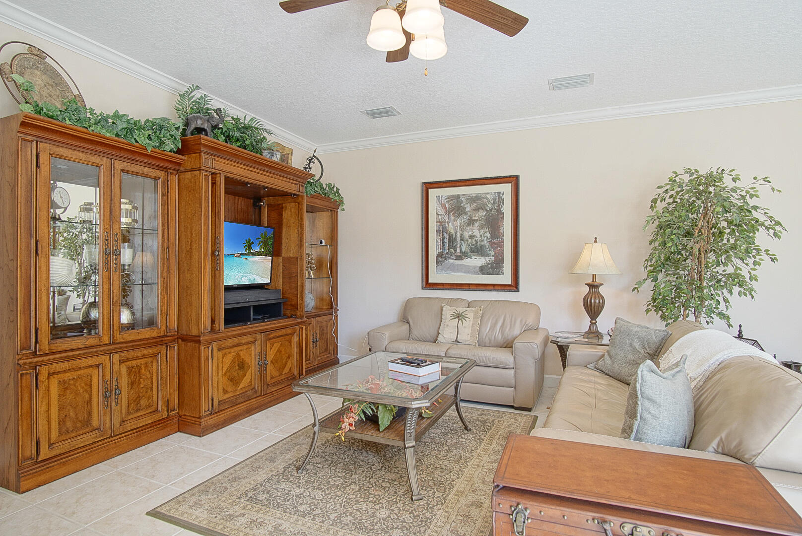 204 River Walk Fort Pierce, FL 34949 - Photo 10 of 30 a living room with furniture a chandelier and a window