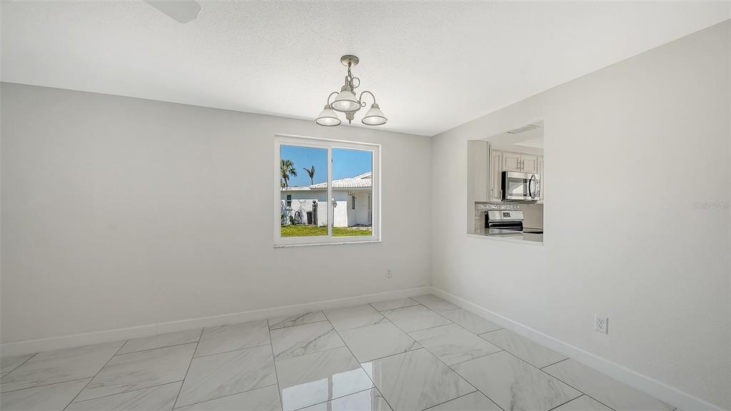 554 Spanish Drive South Longboat Key, FL 34228 - Photo 15 of 72 a view of an empty room with a window