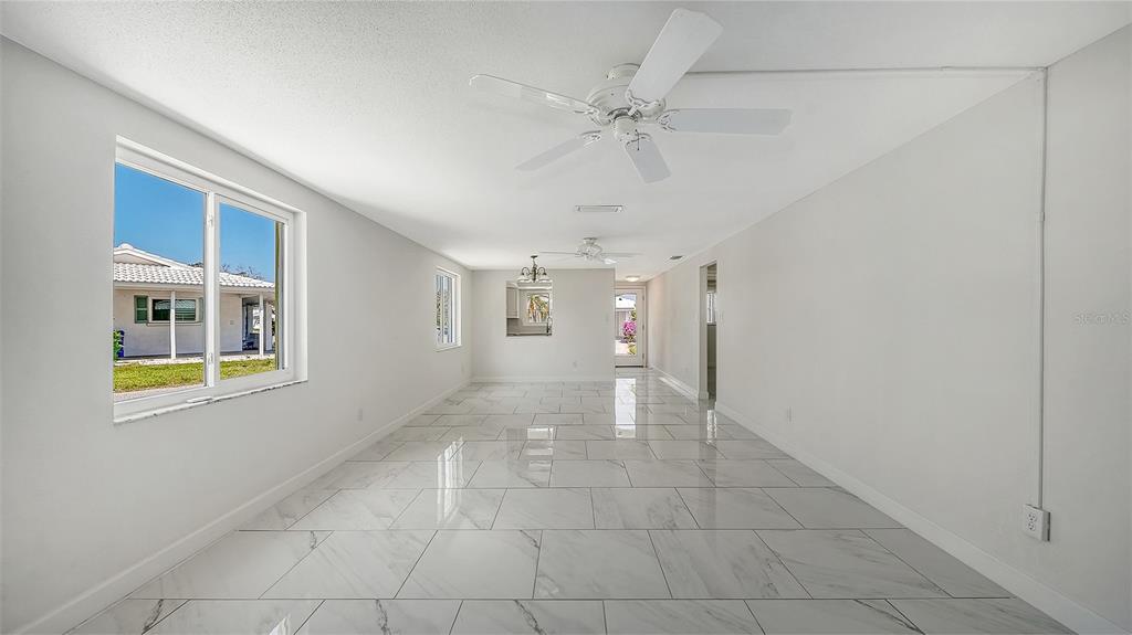 554 Spanish Drive South Longboat Key, FL 34228 - Photo 17 of 72 a view of an empty room with a window
