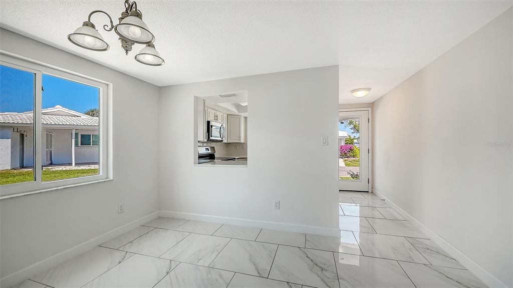554 Spanish Drive South Longboat Key, FL 34228 - Photo 18 of 72 a view of an entryway with a window