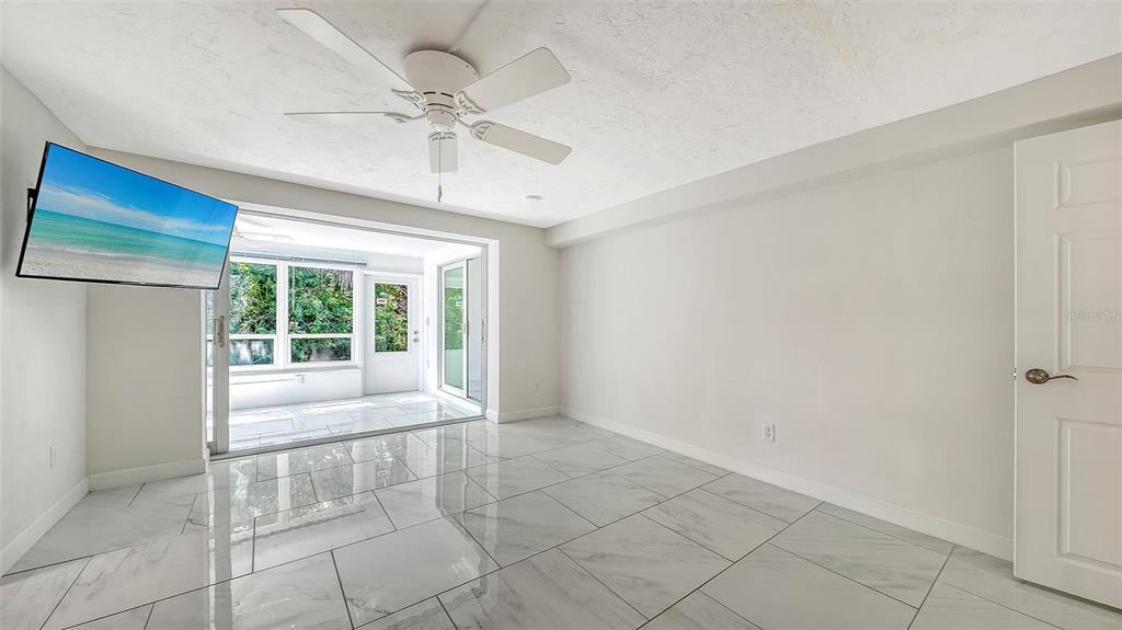554 Spanish Drive South Longboat Key, FL 34228 - Photo 20 of 72 a view of an empty room with a window