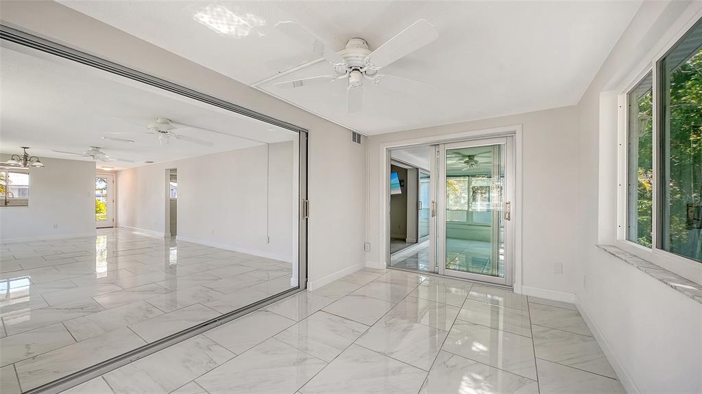 554 Spanish Drive South Longboat Key, FL 34228 - Photo 29 of 72 a view of an entryway with wooden floor