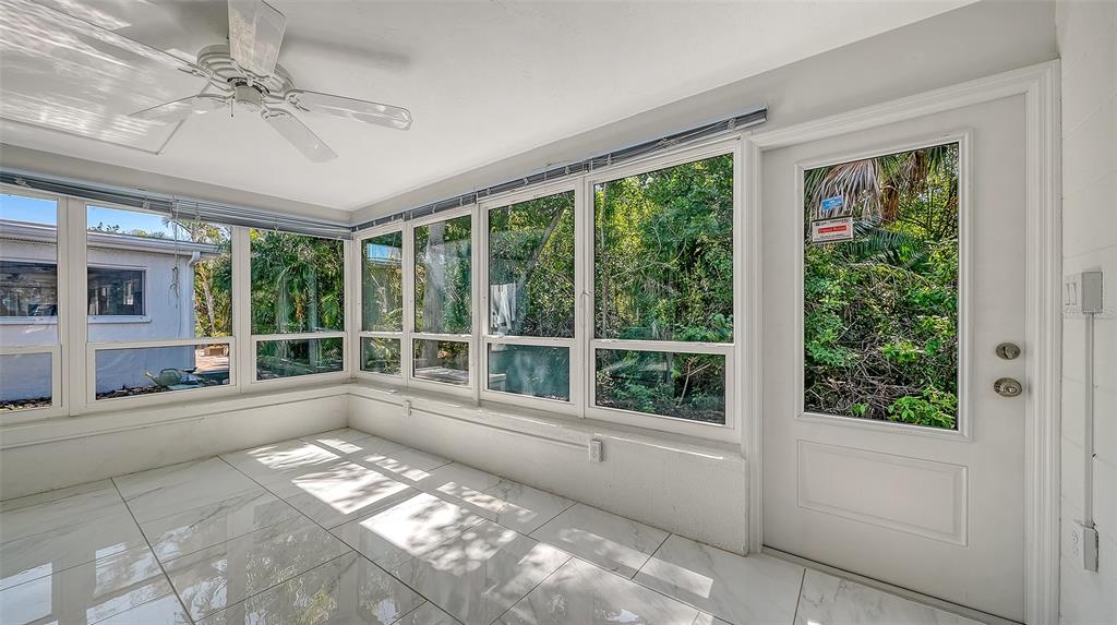 554 Spanish Drive South Longboat Key, FL 34228 - Photo 31 of 72 a view of a large window with an outdoor space
