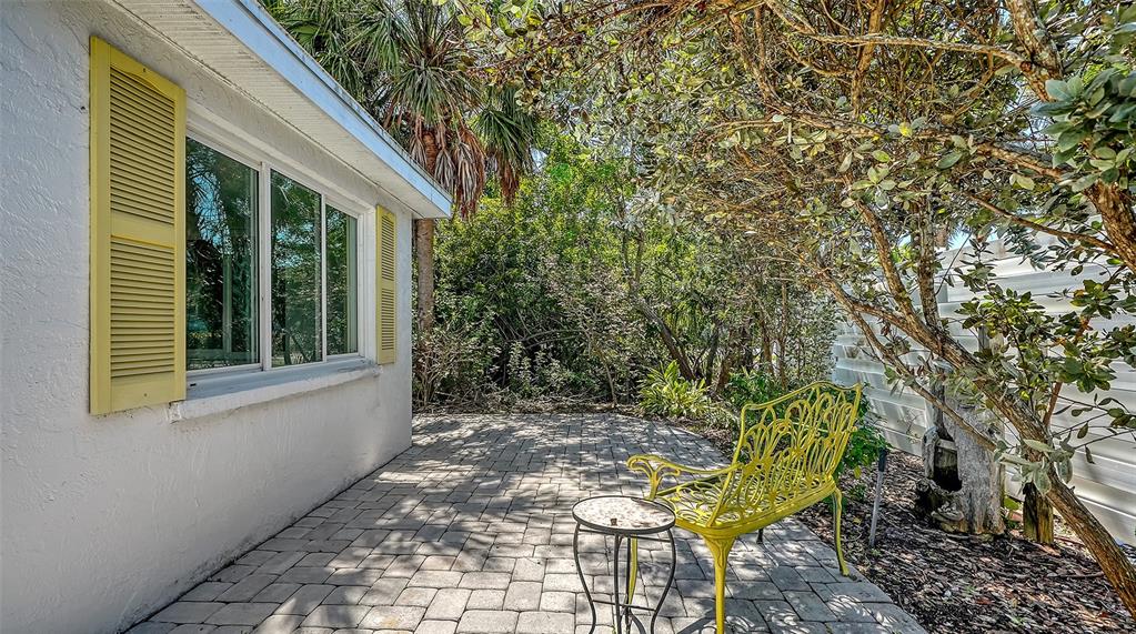554 Spanish Drive South Longboat Key, FL 34228 - Photo 37 of 72 a view of a house with backyard and sitting area