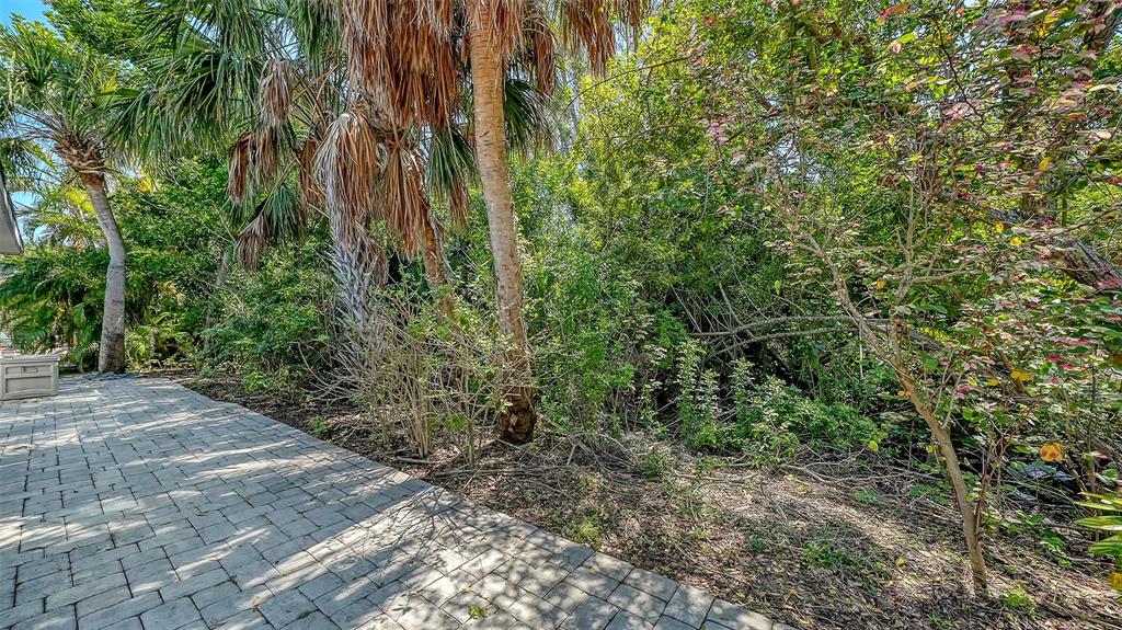 554 Spanish Drive South Longboat Key, FL 34228 - Photo 38 of 72 a view of a garden with plants