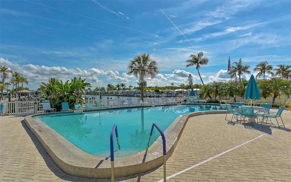 554 Spanish Drive South Longboat Key, FL 34228 - Photo 44 of 72 a view of a swimming pool from a balcony