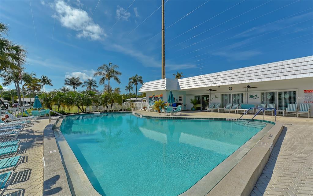 554 Spanish Drive South Longboat Key, FL 34228 - Photo 46 of 72 a view of swimming pool with outdoor seating and lake view