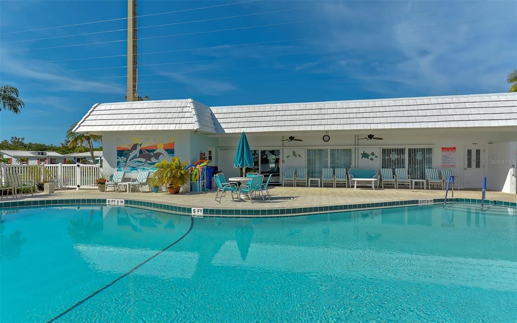 554 Spanish Drive South Longboat Key, FL 34228 - Photo 47 of 72 a view of a swimming pool with furniture