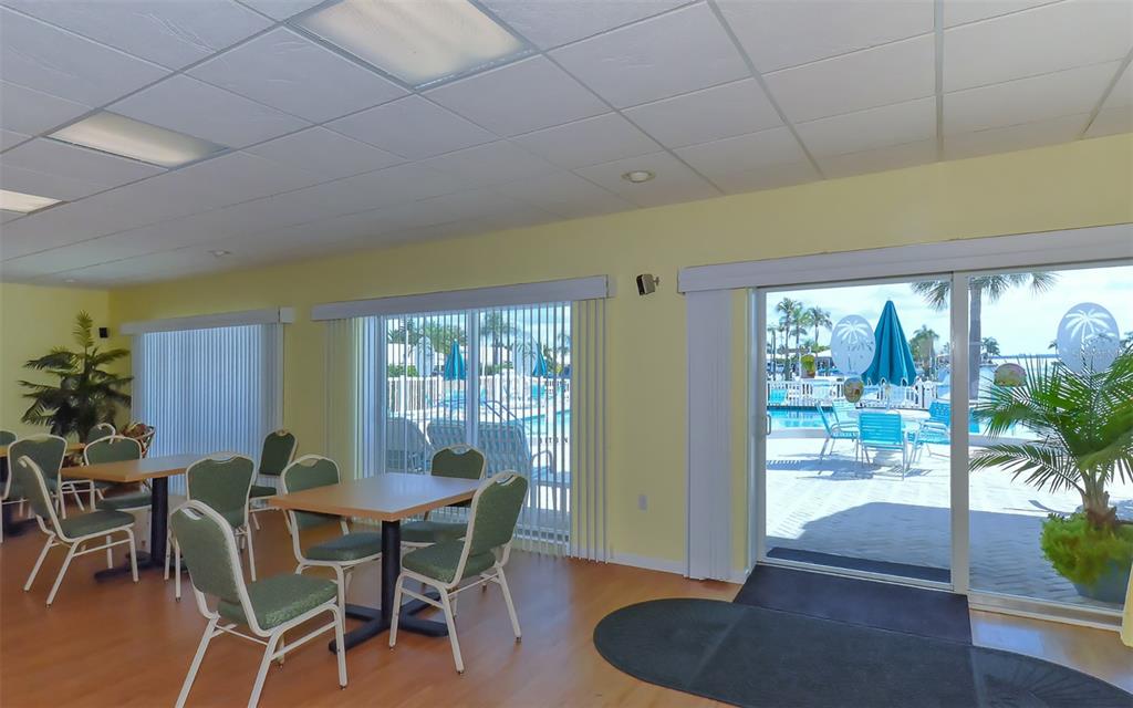 554 Spanish Drive South Longboat Key, FL 34228 - Photo 48 of 72 a view of a dining room with furniture window and outside view
