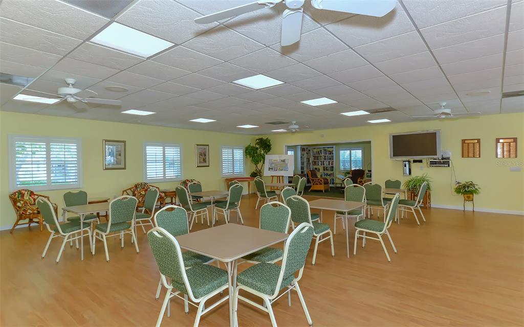 554 Spanish Drive South Longboat Key, FL 34228 - Photo 49 of 72 a view of a dining room with furniture window and wooden floor