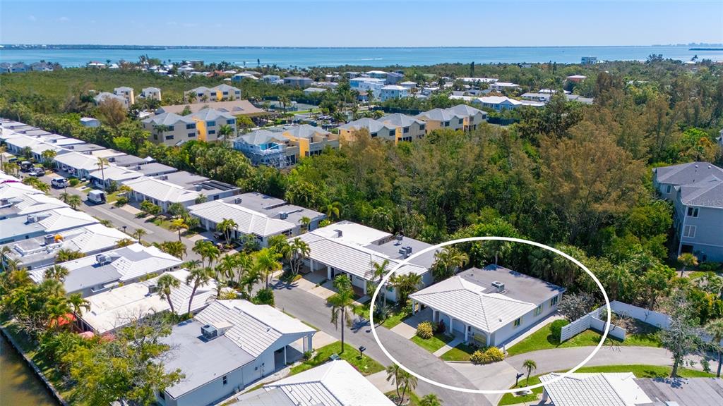 554 Spanish Drive South Longboat Key, FL 34228 - Photo 5 of 72 an aerial view of a house with a garden