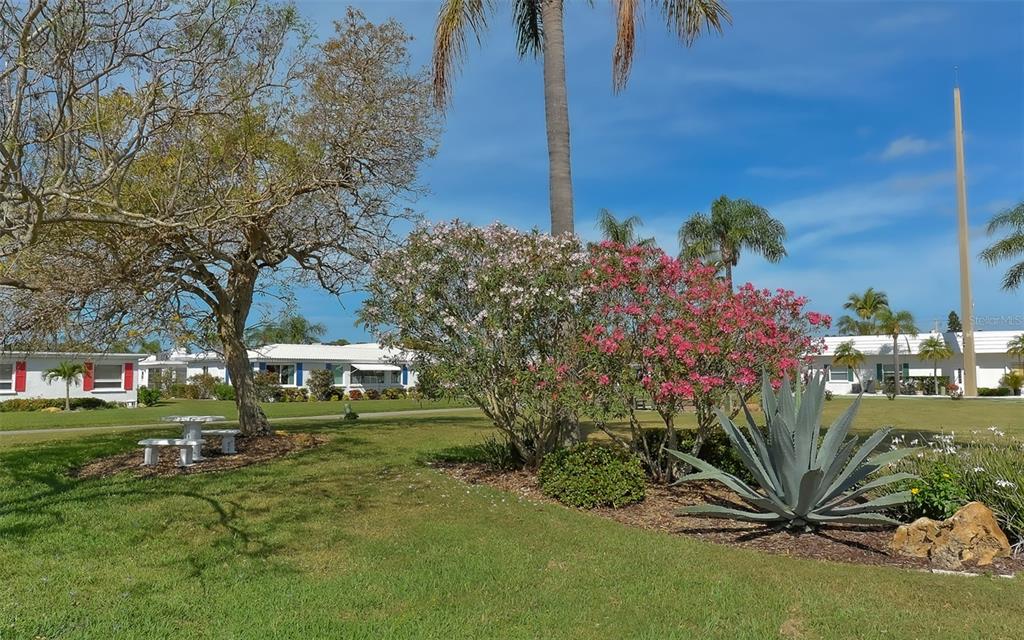 554 Spanish Drive South Longboat Key, FL 34228 - Photo 53 of 72 a view of a house with a yard
