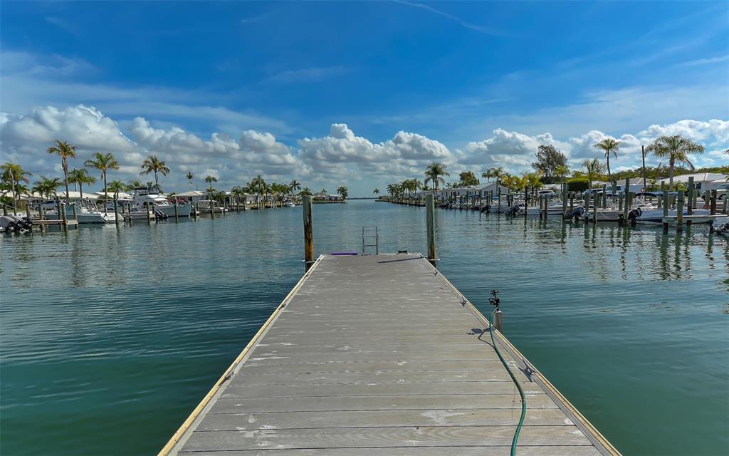 554 Spanish Drive South Longboat Key, FL 34228 - Photo 58 of 72 a view of a lake with outdoor space