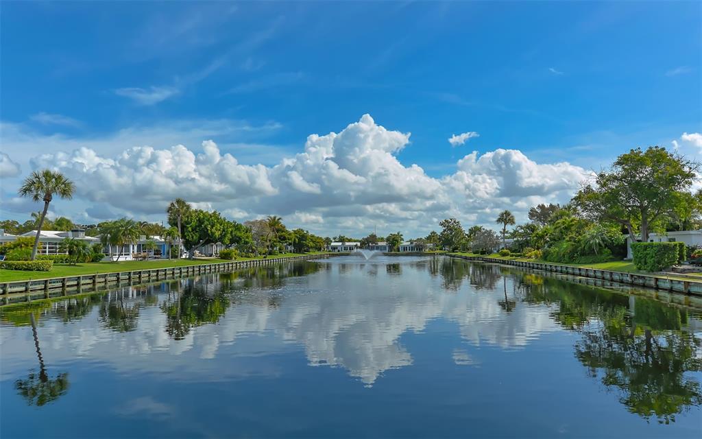 554 Spanish Drive South Longboat Key, FL 34228 - Photo 65 of 72 a view of a lake with houses in the back