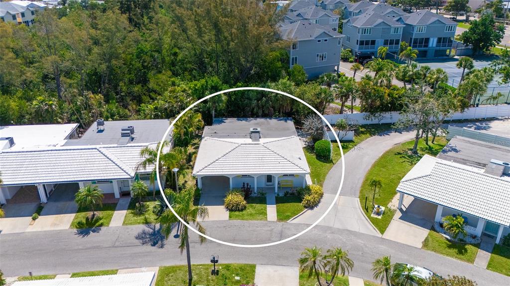 554 Spanish Drive South Longboat Key, FL 34228 - Photo 7 of 72 an aerial view of a house with swimming pool and outdoor seating