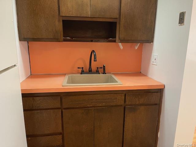 212 5th Avenue West Babylon, NY 11704 - Photo 2 of 17 a bathroom with a sink and a mirror