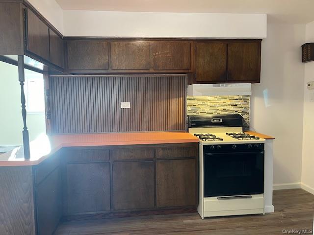 212 5th Avenue West Babylon, NY 11704 - Photo 3 of 17 a stove top oven sitting inside of a kitchen