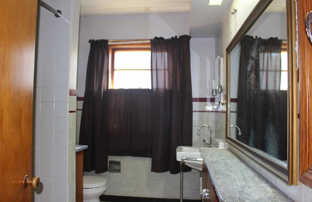 316 West Perry Street Belvidere, IL 61008 - Photo 13 of 21 a living room with furniture and a window