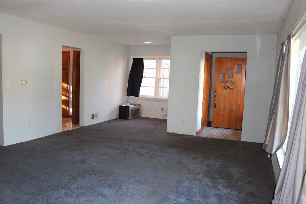 316 West Perry Street Belvidere, IL 61008 - Photo 4 of 21 an empty room with windows and closet