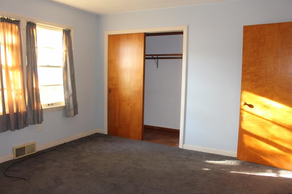 316 West Perry Street Belvidere, IL 61008 - Photo 9 of 21 a view of an empty room with a window