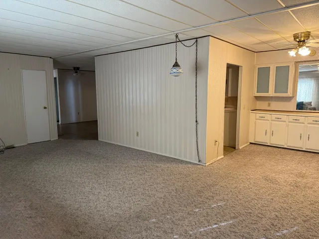 a view of a big room with closet and wooden floor