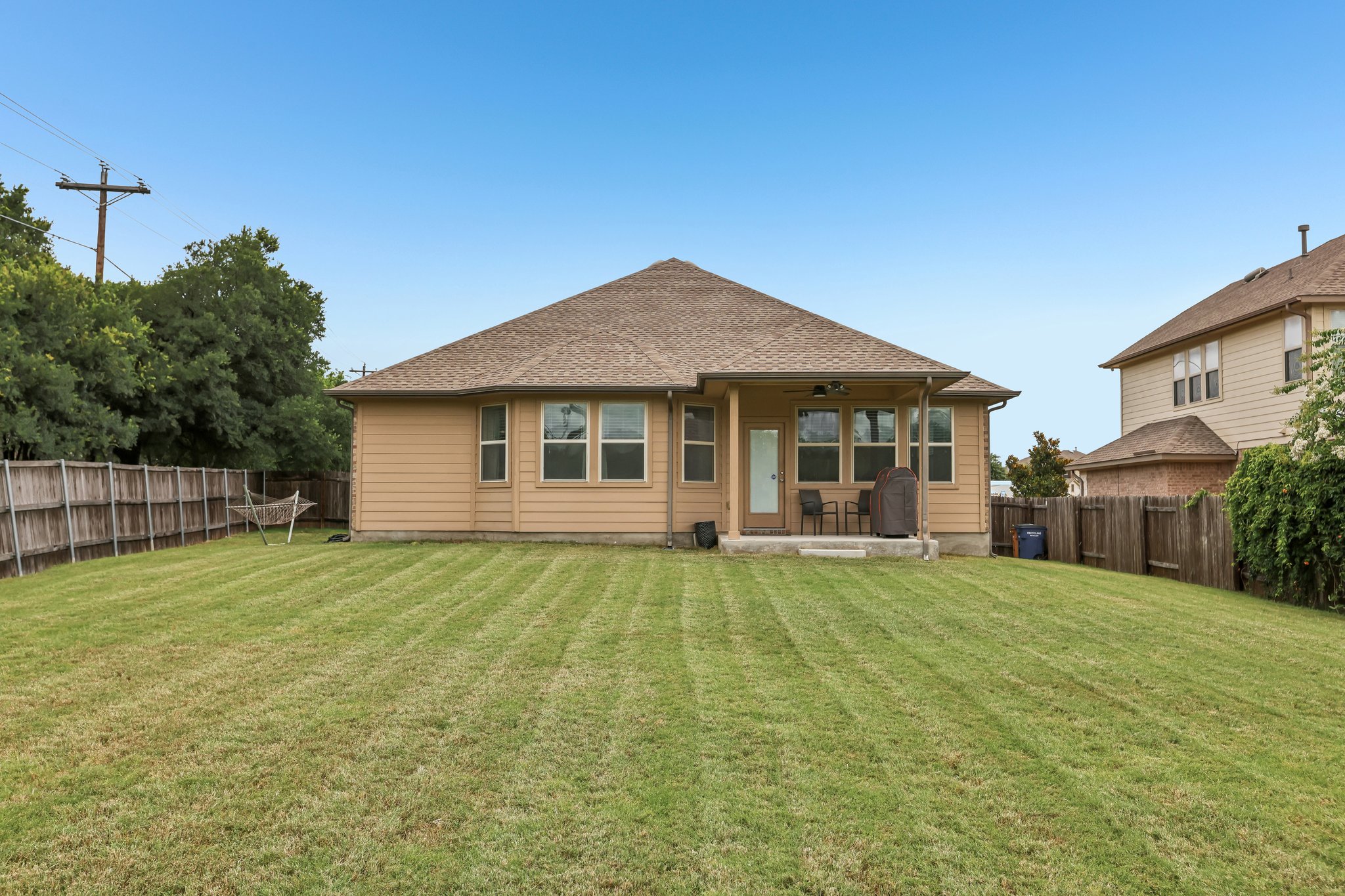 6801 Banff Cove Austin, TX 78754 - Photo 32 of 37 A sprawling lawn surrounds this home, offering ample outdoor living space