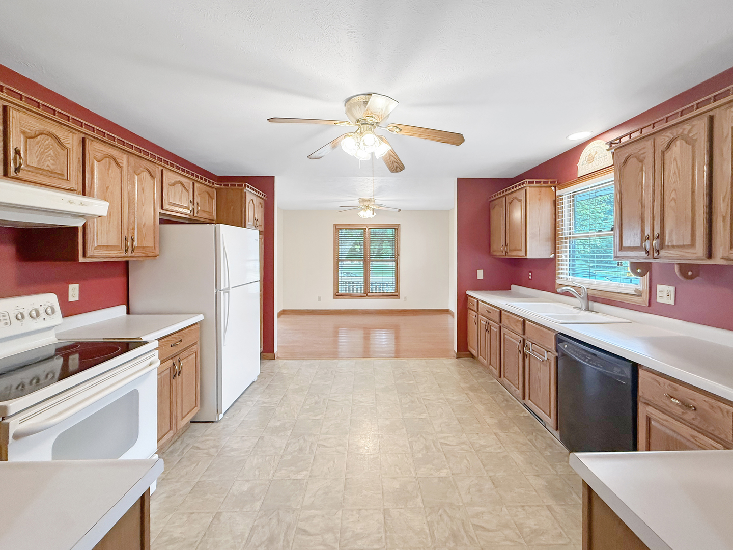 100 Adams Street Ridott, IL 61067 - Photo 2 of 17 a kitchen with stainless steel appliances a stove a sink and a refrigerator