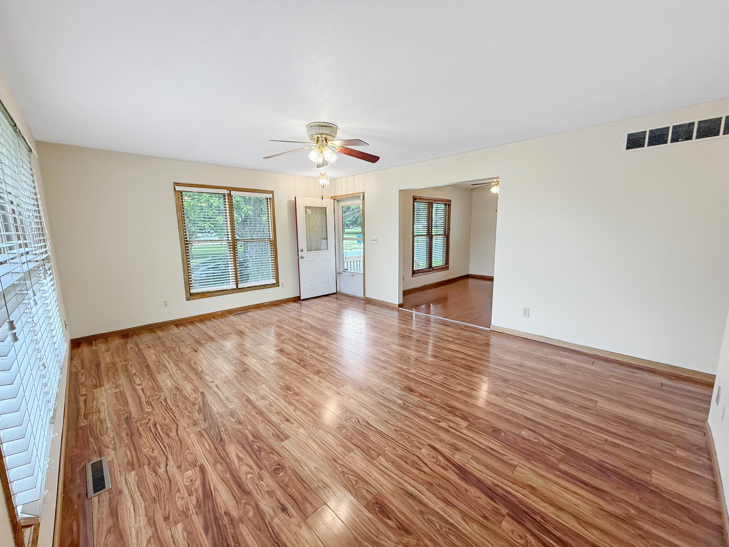 100 Adams Street Ridott, IL 61067 - Photo 4 of 17 wooden floor in an empty room with a window