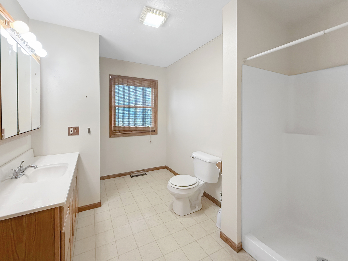 100 Adams Street Ridott, IL 61067 - Photo 9 of 17 a bathroom with a toilet sink and a mirror