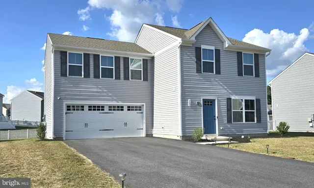 a view of a house with a street
