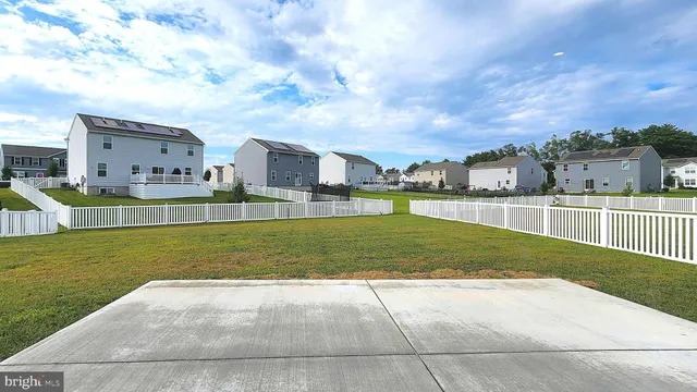 a view of a swimming pool and a yard